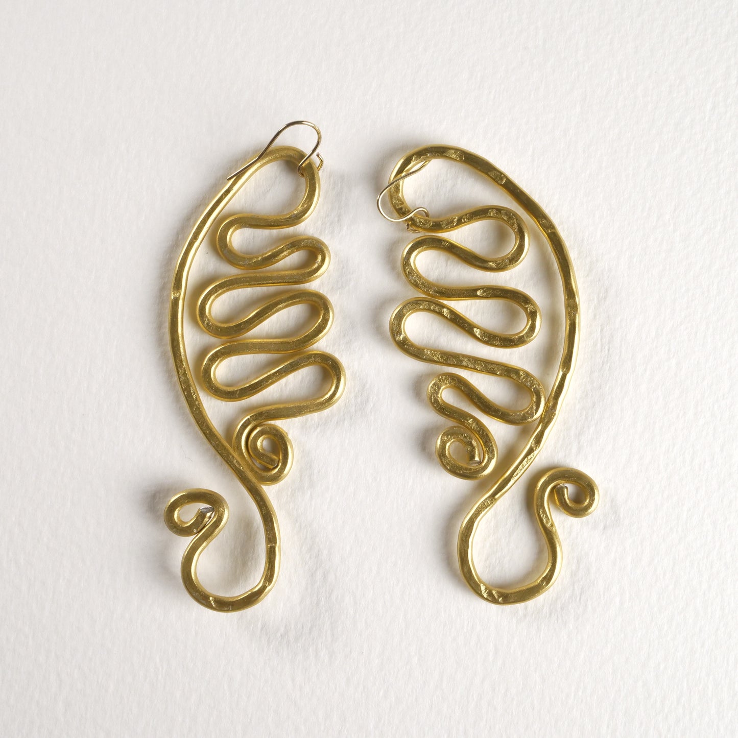 Boucles d'oreilles à motif vague abstraite